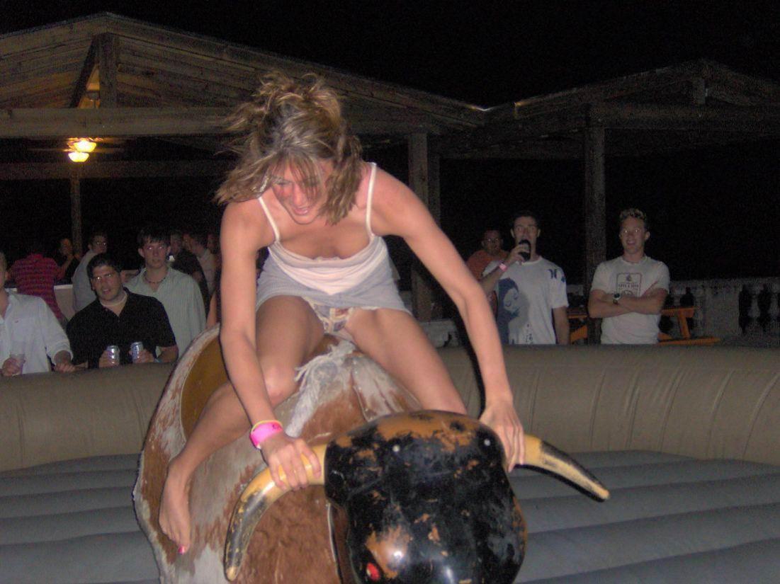 Girl rides bull