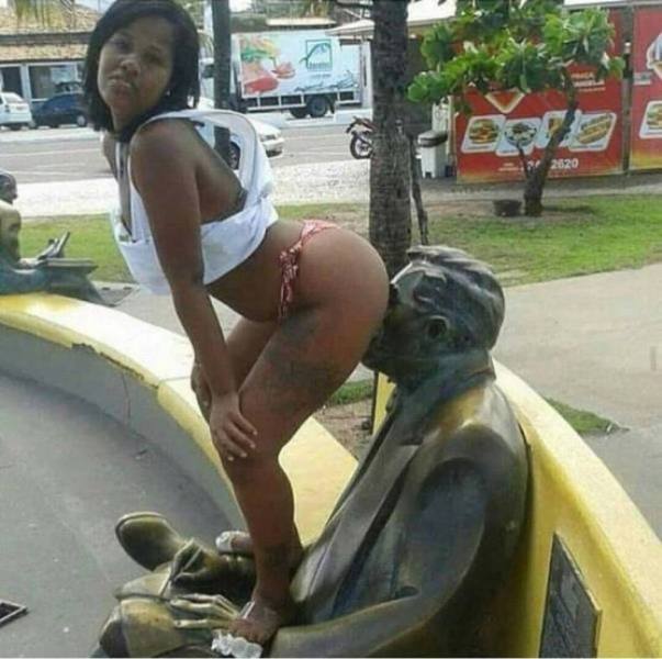 Girls posing with their favorite statues