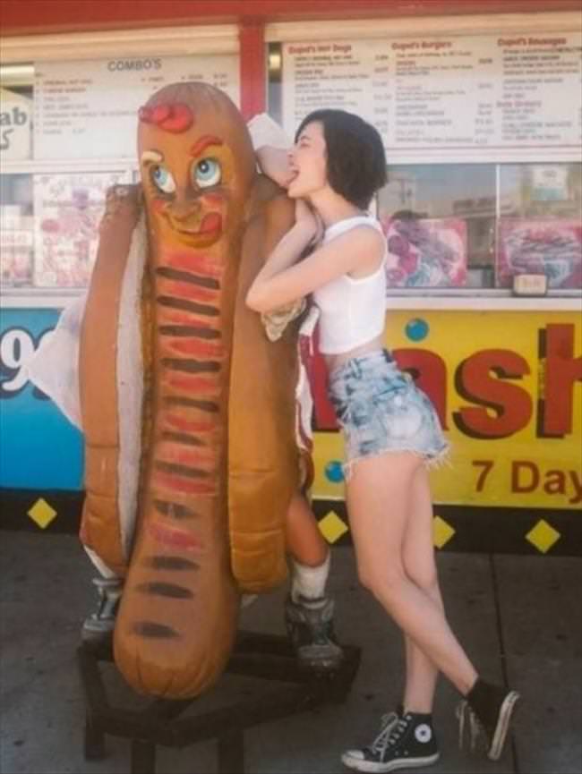 Girls posing with their favorite statues