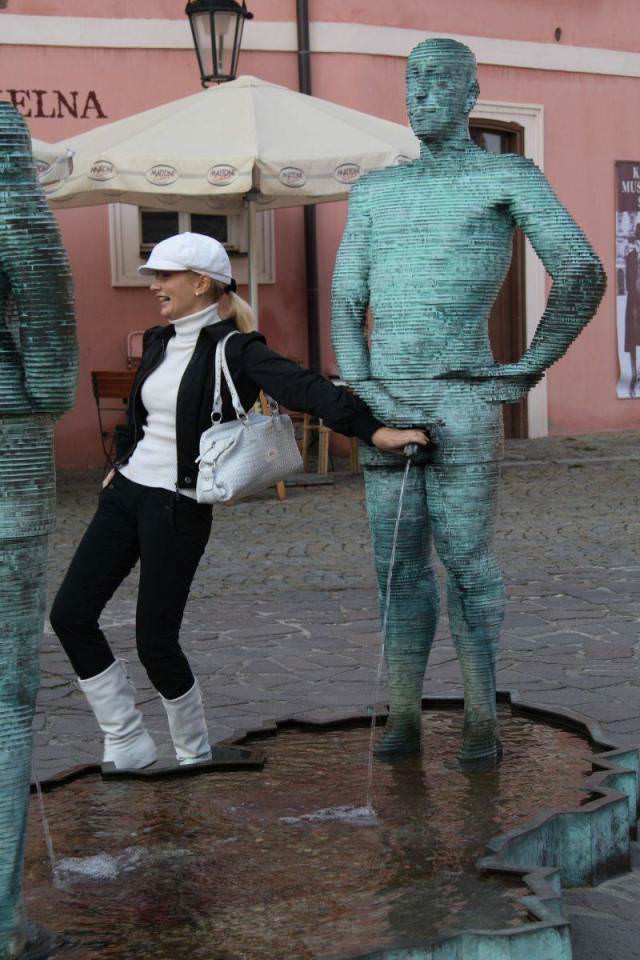 Girls posing with their favorite statues