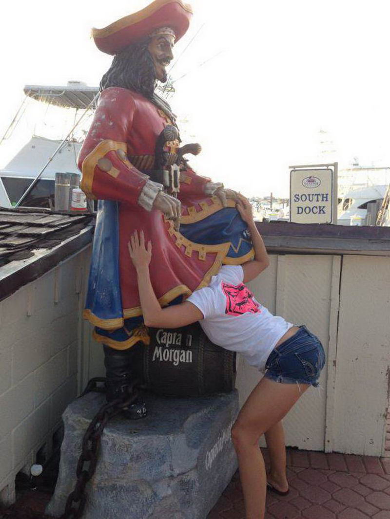 Girls posing with their favorite statues