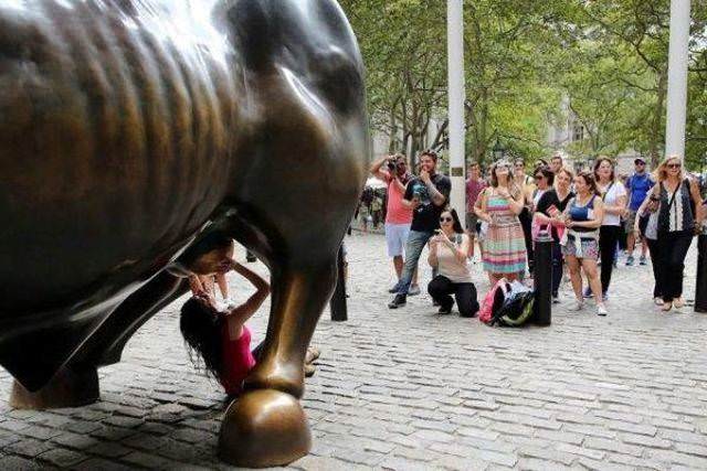 Girls posing with their favorite statues